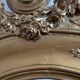 Large antique baroque mirror with angel decorations.
