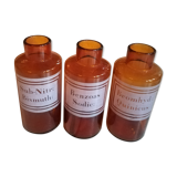 Trio pharmacy bottles