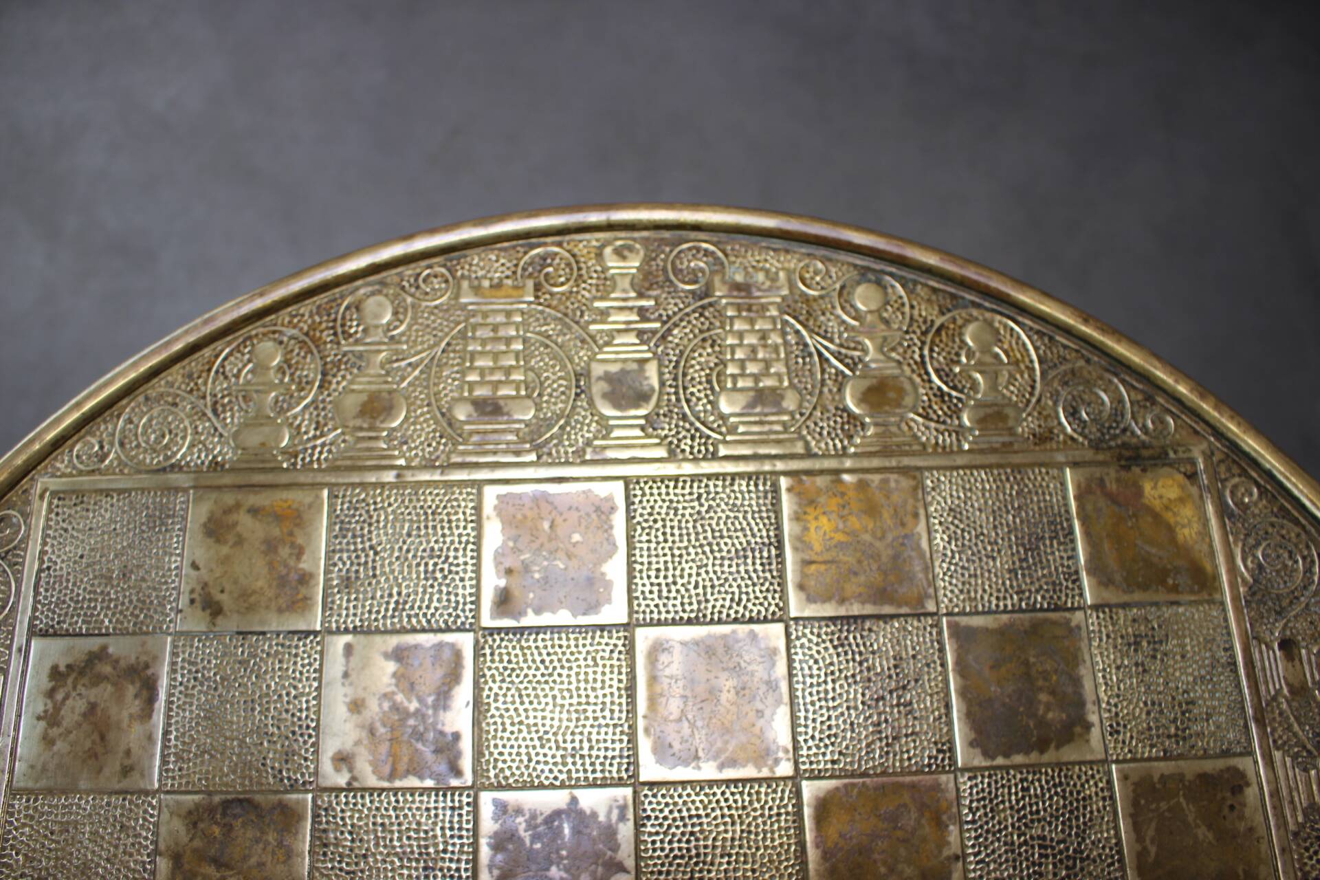 Art Deco chess table from the 1930s with a hand-decorated brass top and a stained oak base.