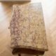 Chiffonnier galbé Louis XV en bois de rose et marbre beige