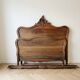 Antique double bed in carved solid wood in Louis XV style.
