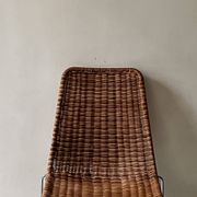 Chair made of rattan, wicker and chrome-plated metal