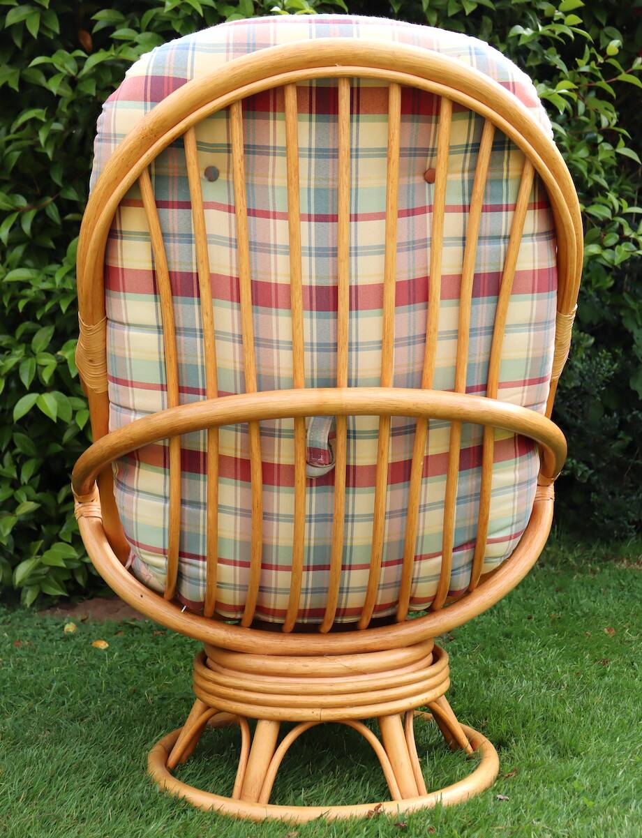 Swivel rattan armchair with matching ottoman