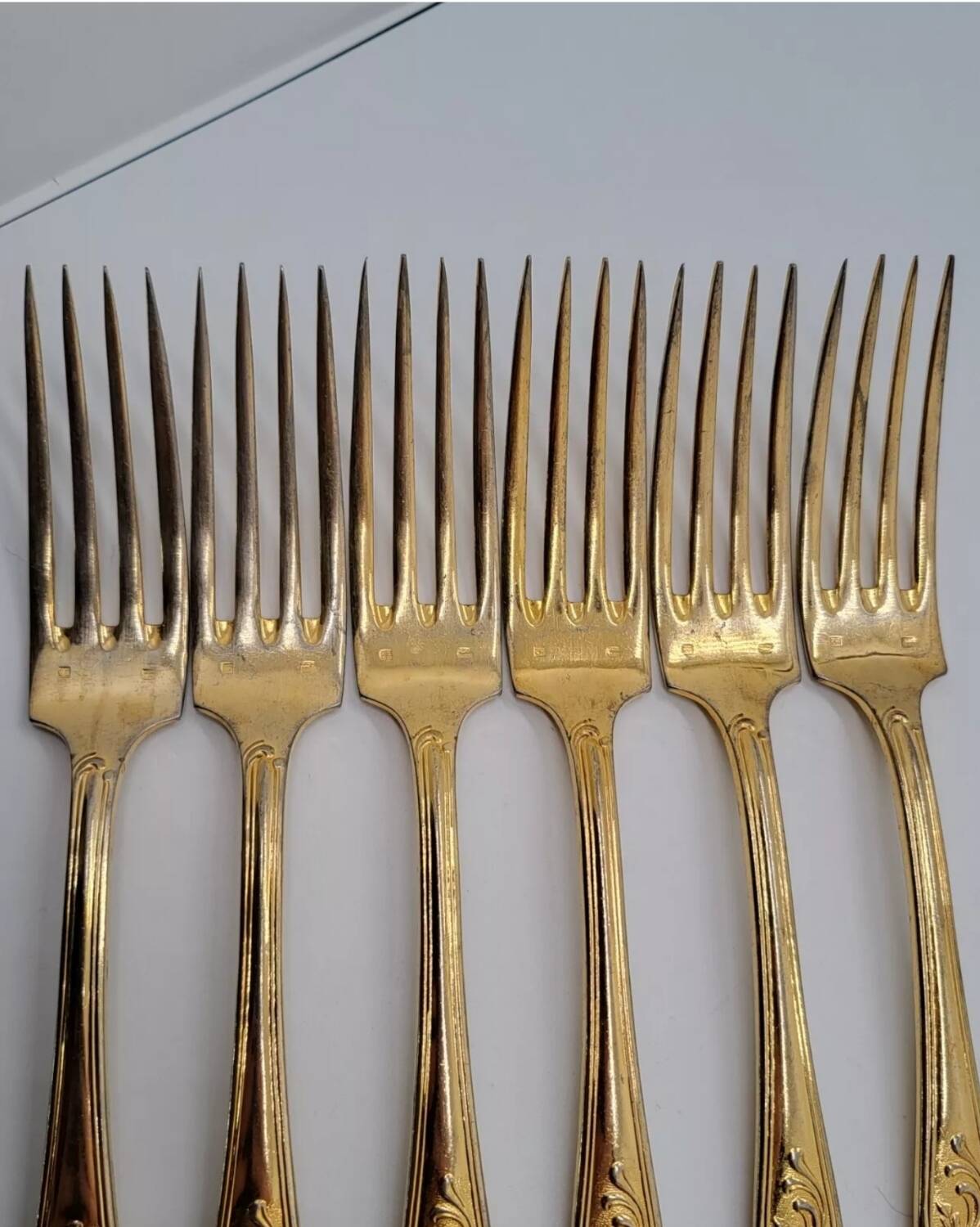 12 Table Forks in gold metal
