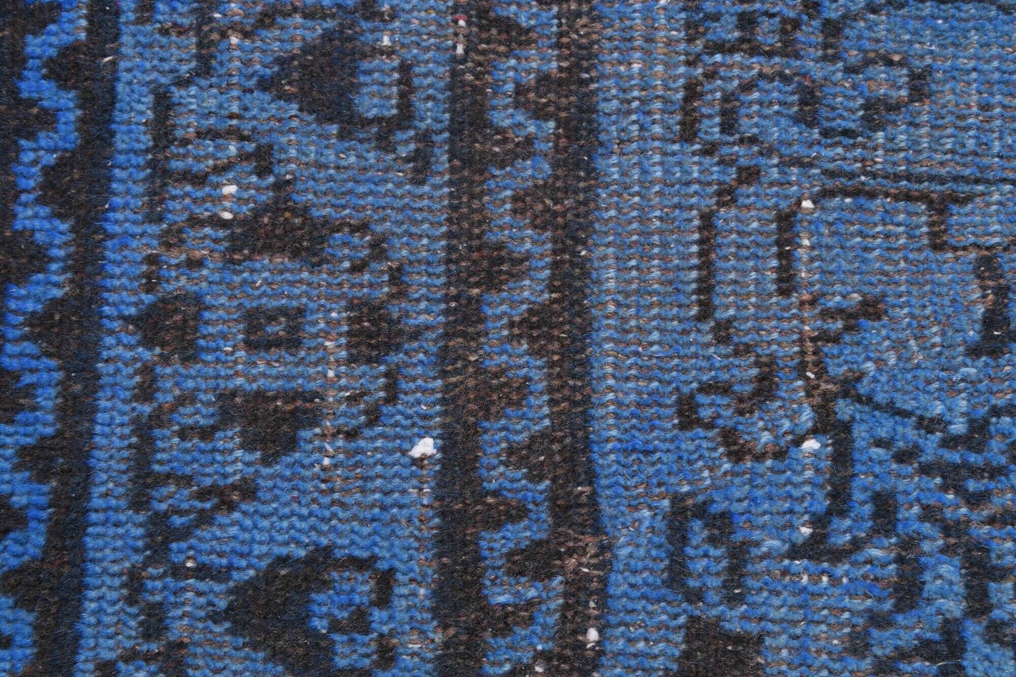 Vintage blue and black Turkish rug with traditional design, 163 × 268 cm