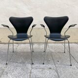 Pair of Arne Jacobsen series 7 chairs in black leather