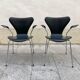 Pair of Arne Jacobsen series 7 chairs in black leather