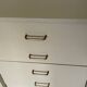Mocha compass foot chest of drawers