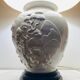 1980s ceramic table lamp with a wooden base and adjustable shade.