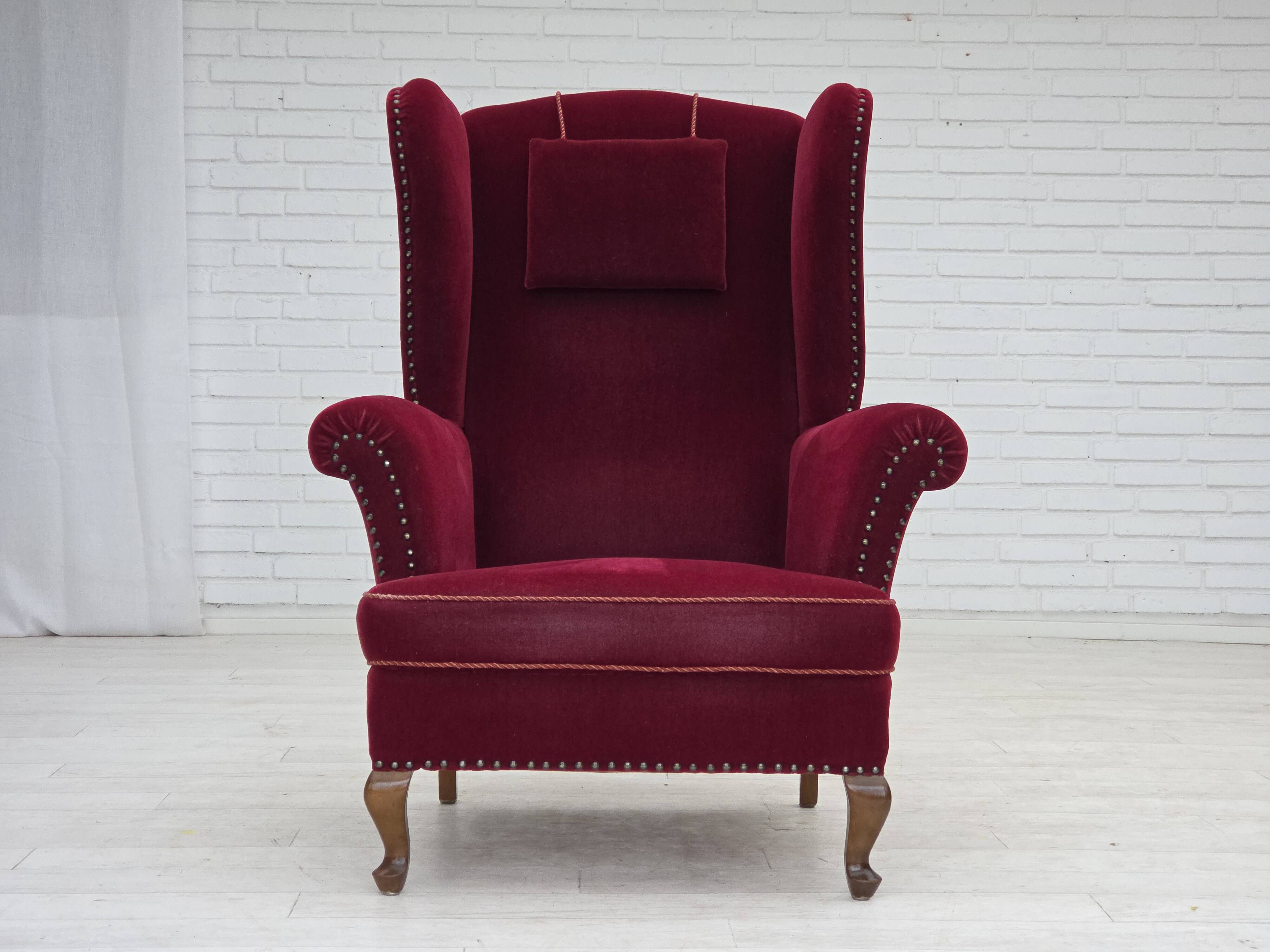 1960s, Danish highback wingback armchair, cherry-red furniture velour.