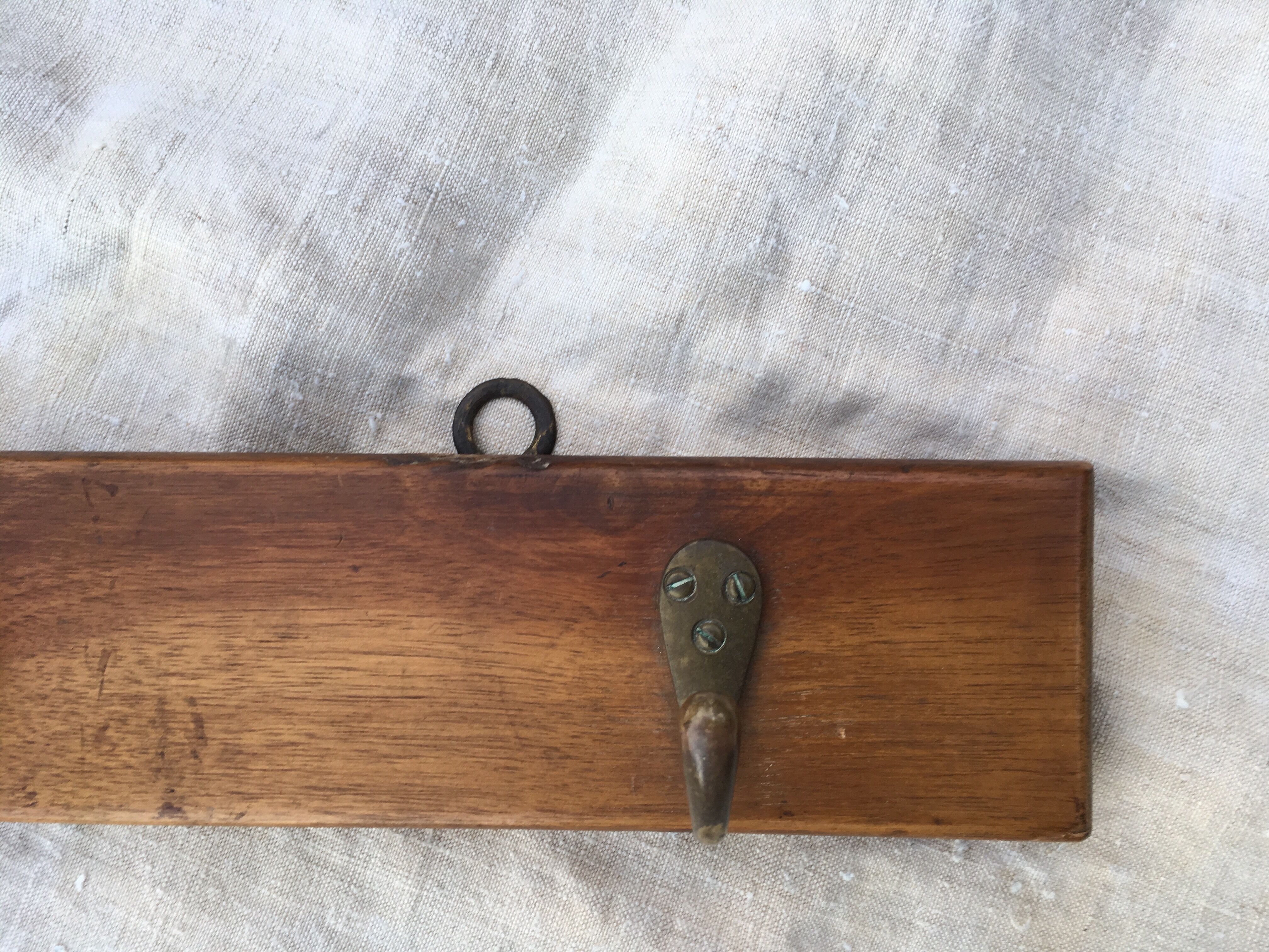 Wall hook from wood and brass