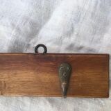 Wall hook from wood and brass
