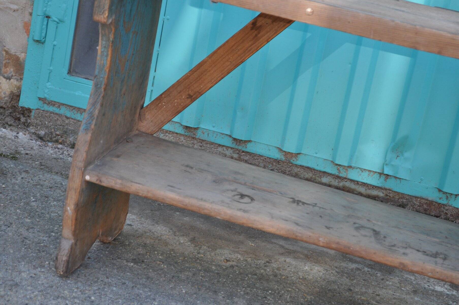 Small brown country bench in solid pine, from the period 1890-1919, rustic style.