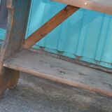 Small brown country bench in solid pine, from the period 1890-1919, rustic style.