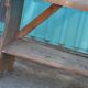 Small brown country bench in solid pine, from the period 1890-1919, rustic style.