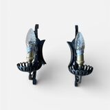 Vintage wrought iron wall lights in rustic gothic style.