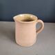 Antique milk jug in glazed terracotta