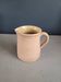 Antique milk jug in glazed terracotta