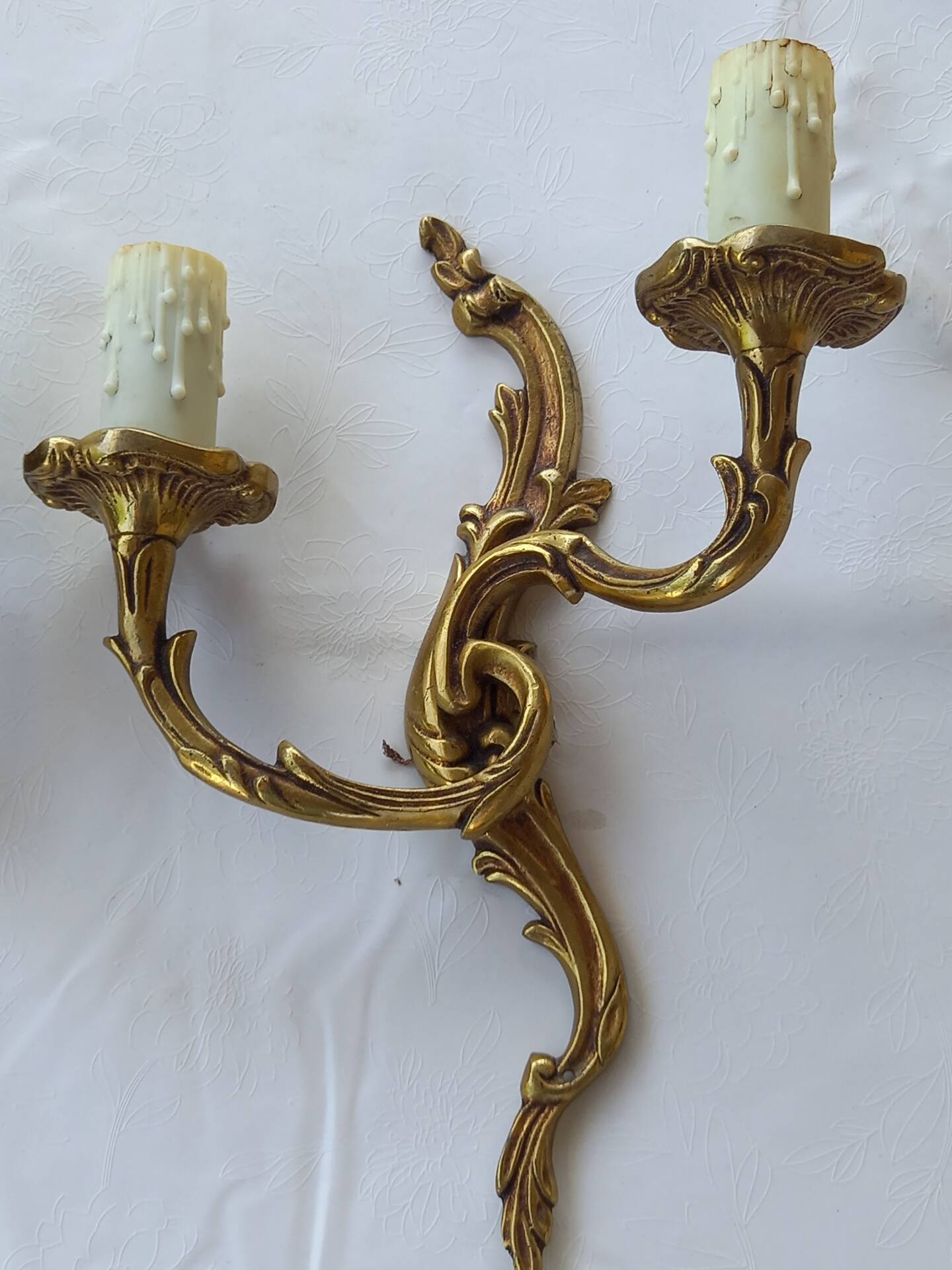 Old pairs of bronze wall sconces
