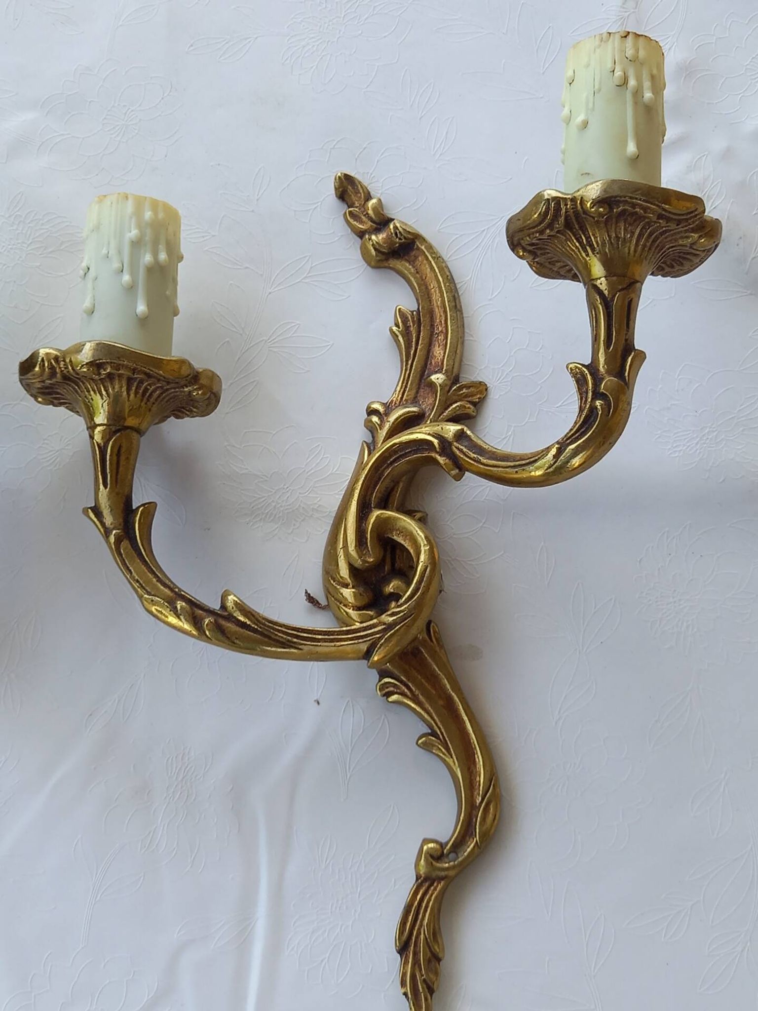 Old pairs of bronze wall sconces