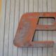 Letter to sign vintage metal 'E '.