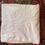 White tablecloth in fine embroidered white cotton.