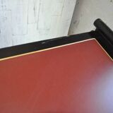 Hungarian Art Deco desk in black painted wood with a brown top and metal handles.