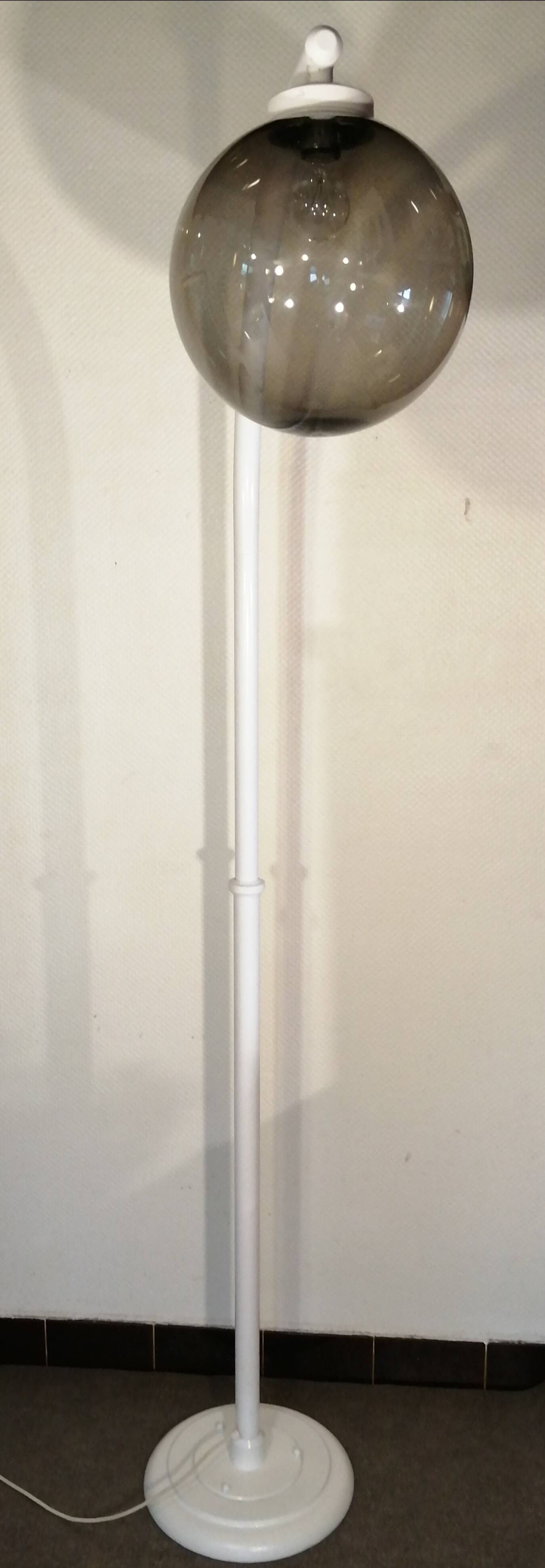 Adjustable metal floor lamp with its vintage smoked ball model from Roger Pradier 1970