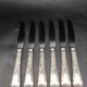 12 silver metal table knives model Rocaille