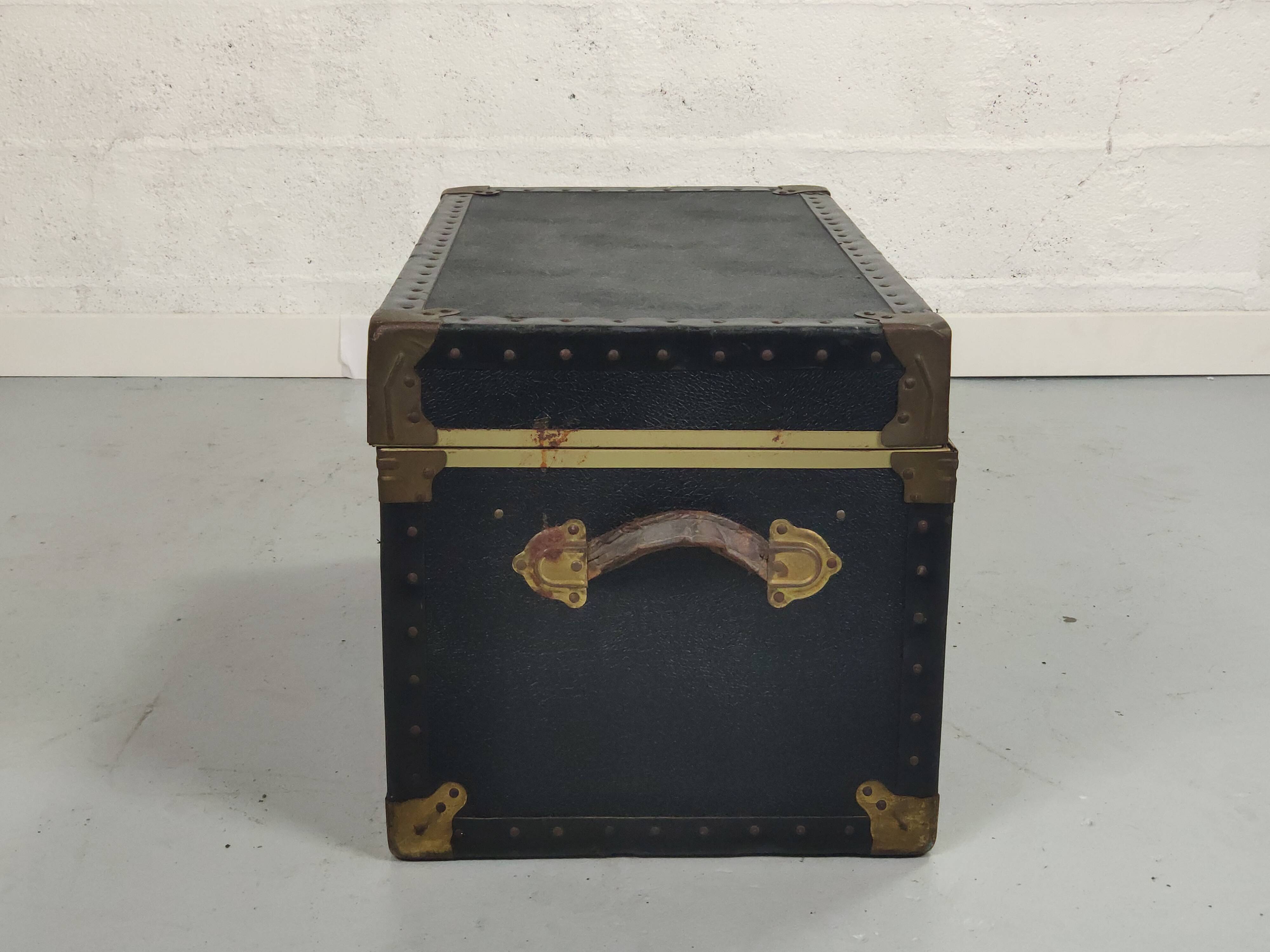 Old black trunk and brass