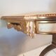Console de style Louis XVI en bois laqué doré