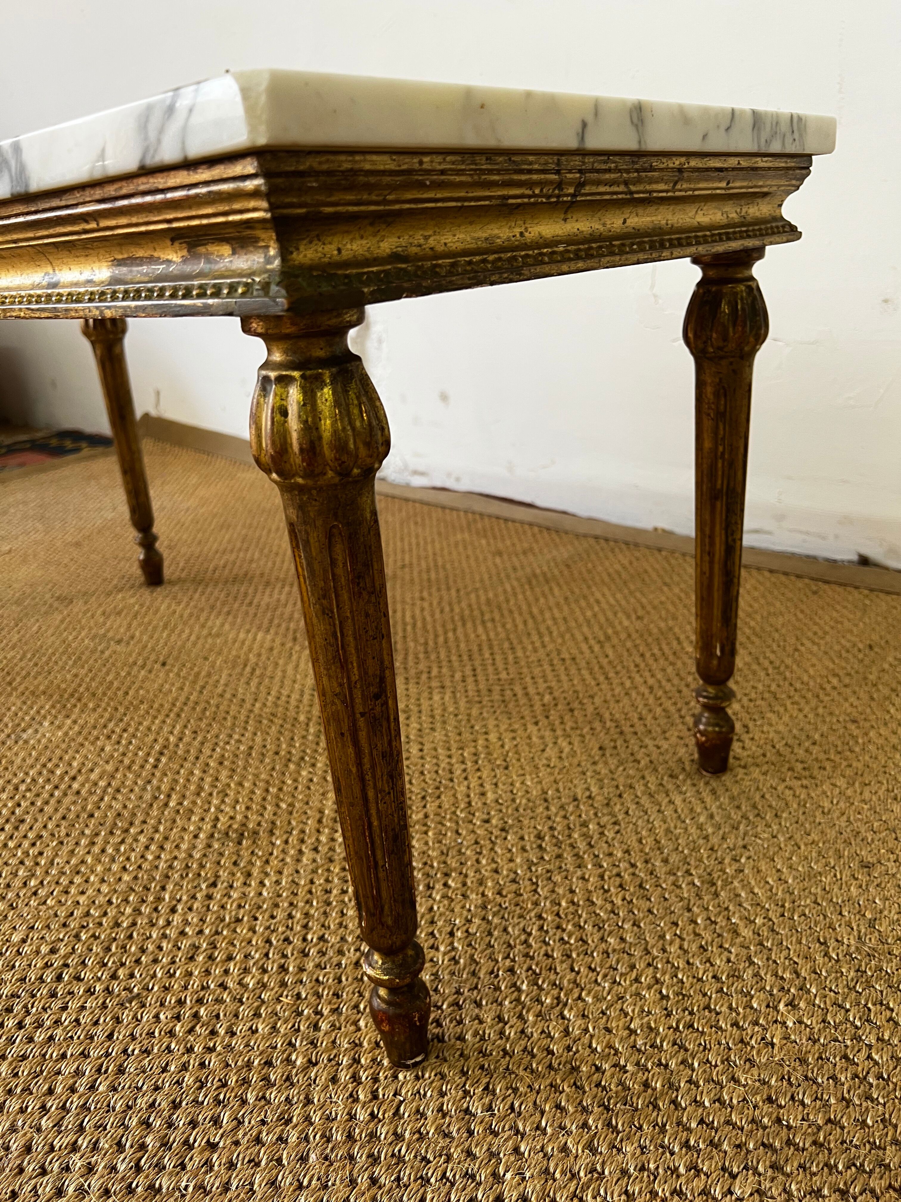 Gilded wood coffee table and marble top Louis XVI style