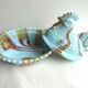 Sweet sugar candy Vallérysthal, blue opaline marbled with brown: Hen on nest