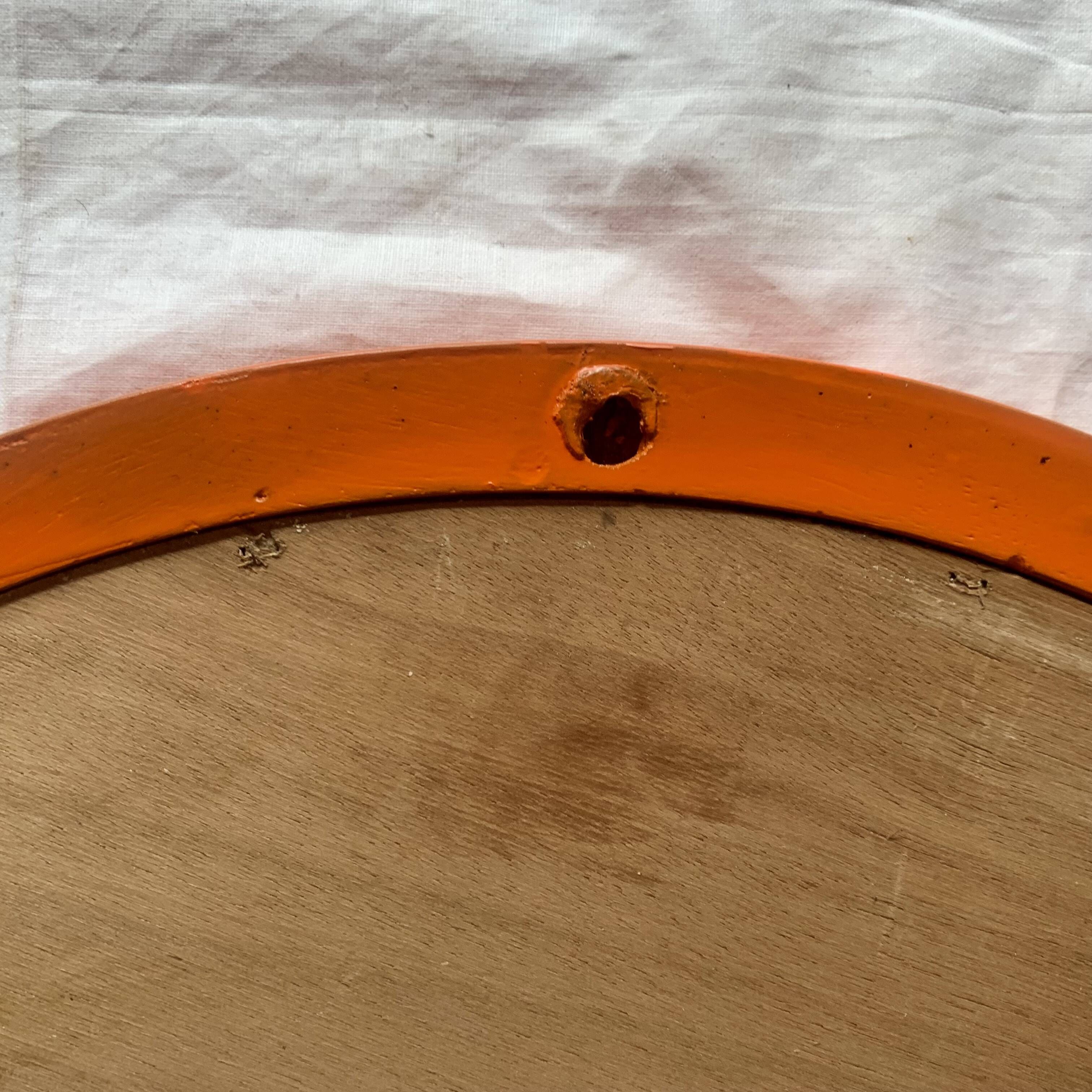 Vintage round wall mirror in orange painted wood - diameter: 48 cm