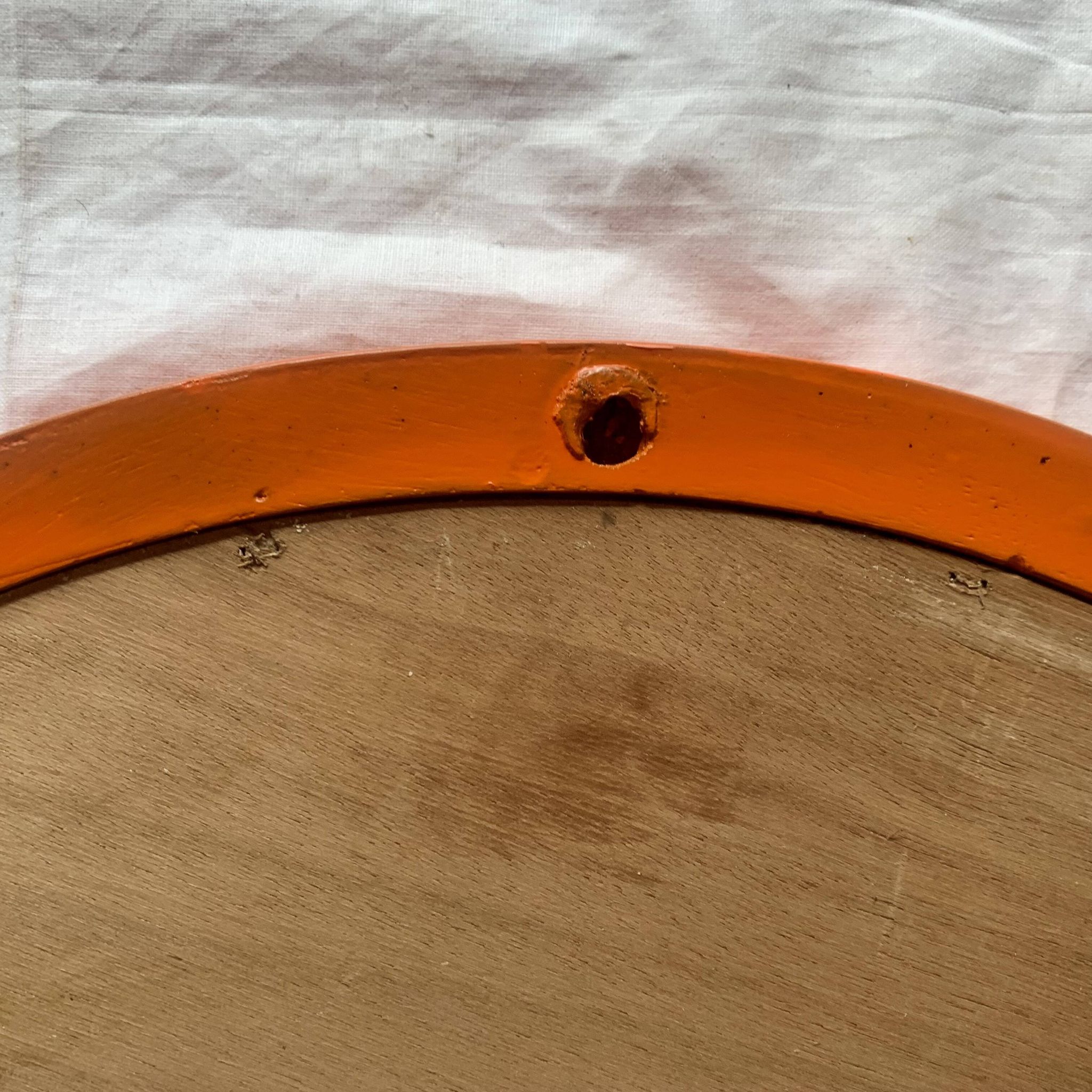 Vintage round wall mirror in orange painted wood - diameter: 48 cm