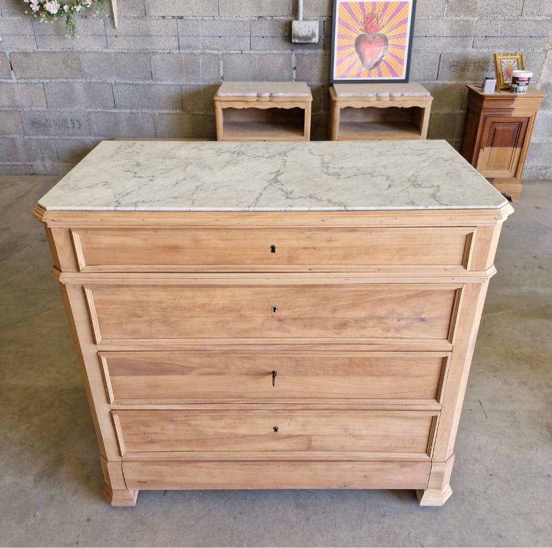 Walnut chest of drawers with white marble.