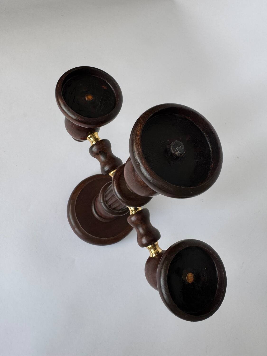 Vintage brutalist wooden candelabrum with gold hardware.