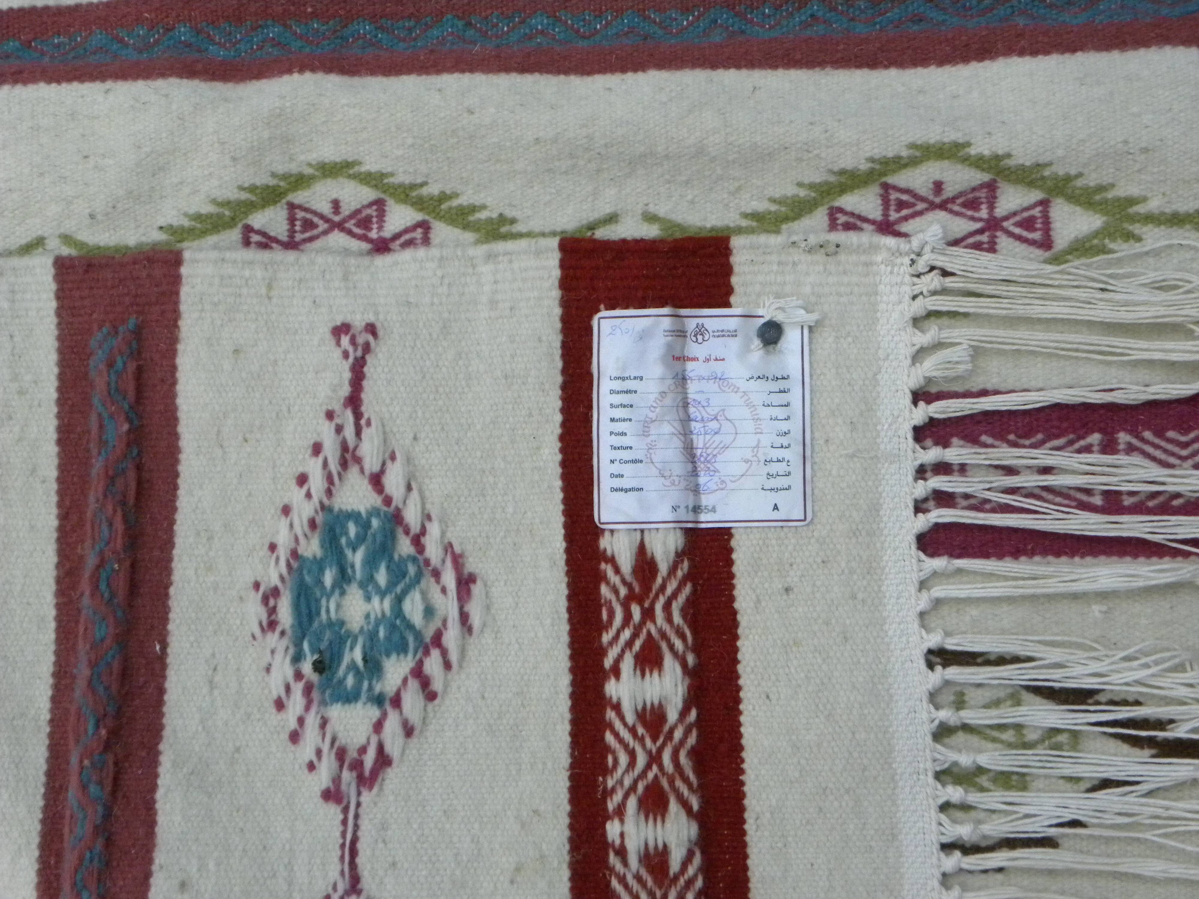 Tribal bohemian kilim rug with geometric pattern in wool.