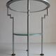 Postmodern round glass  and steel side table, 1980s.