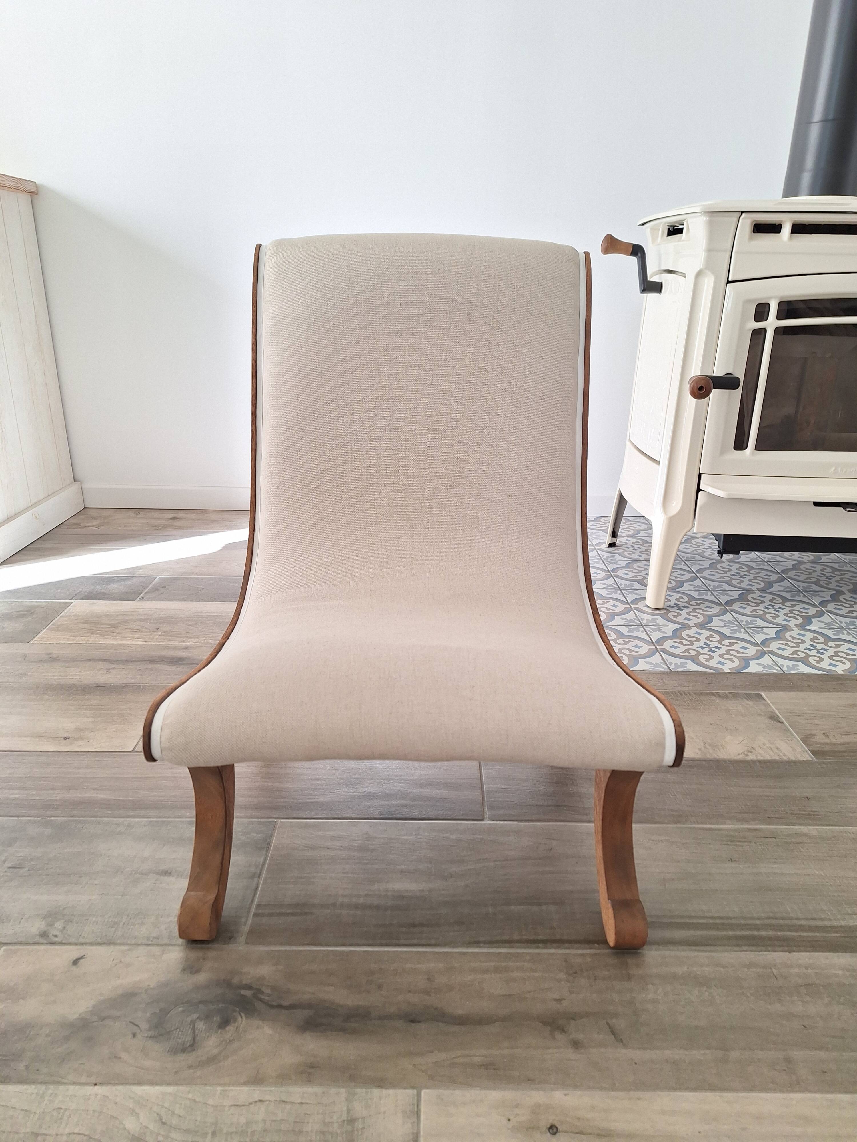 Vintage gondola armchair in beige linen fabric.