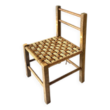 Vintage children's chair made of rope and wood