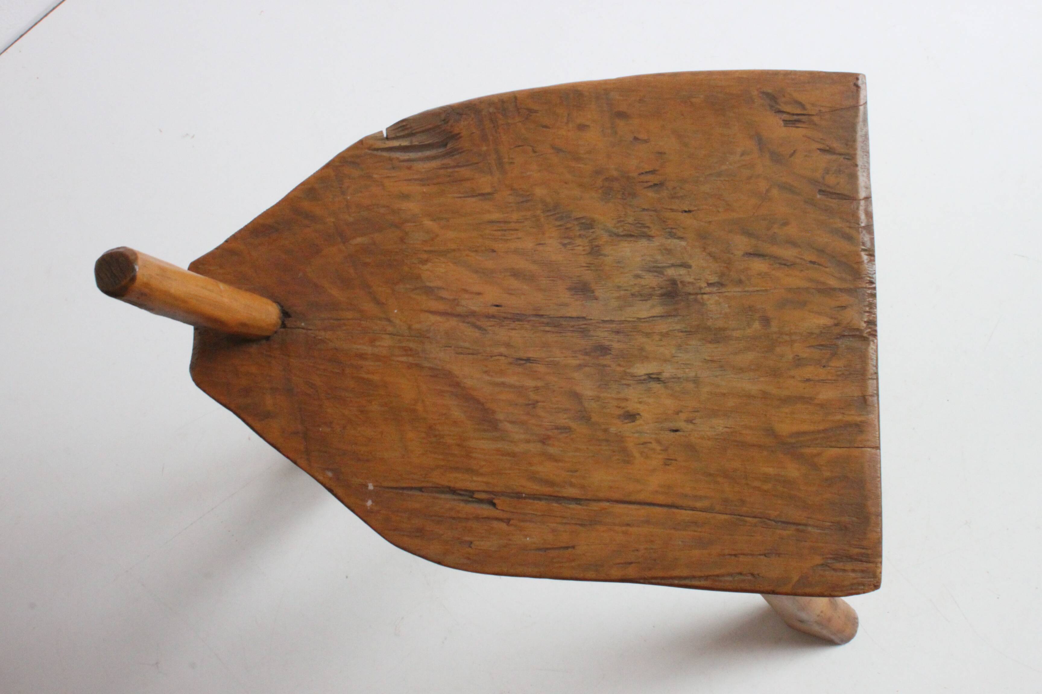 Brutalist tripod stool in carved wood, 1950s