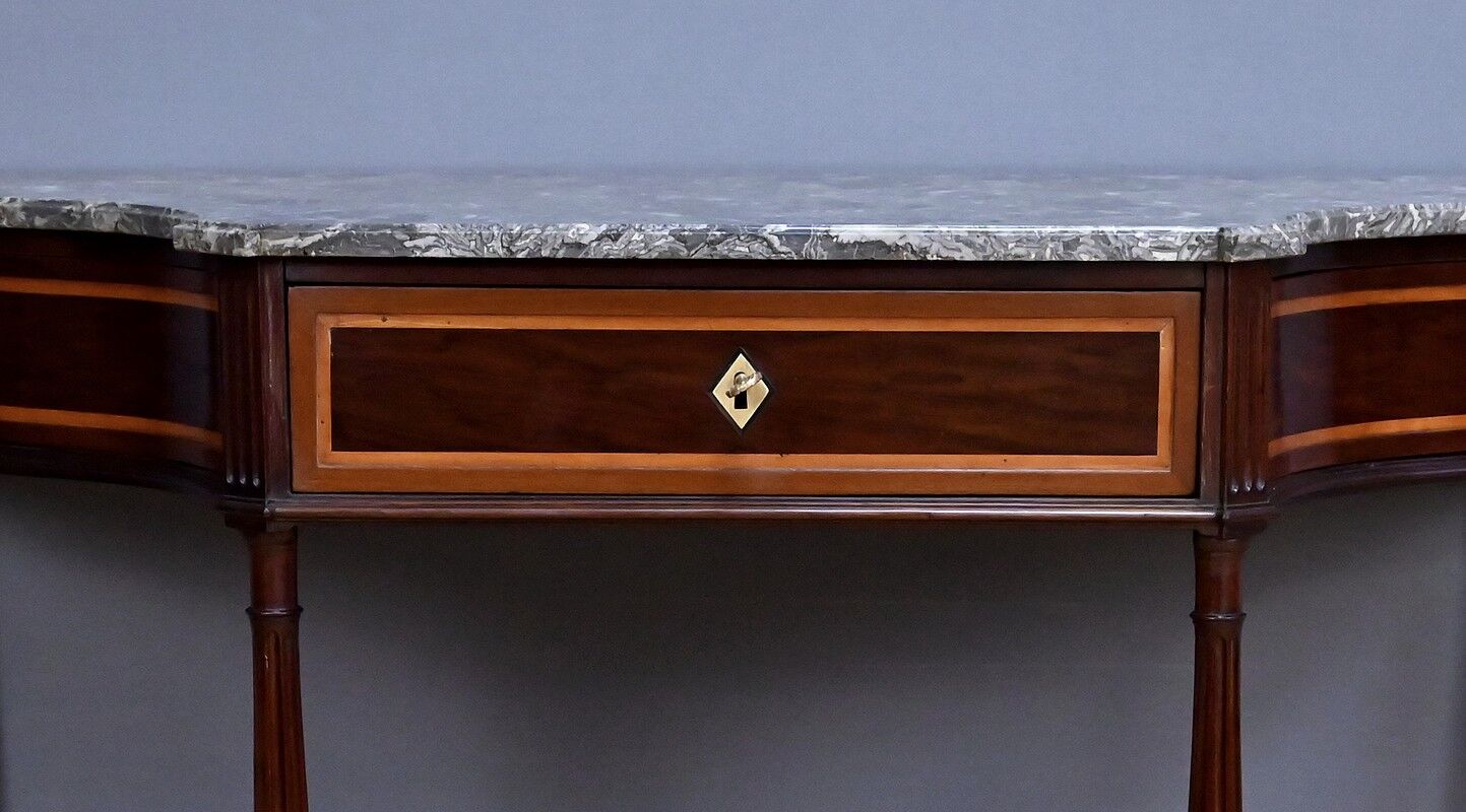 Console in mahogany and marble, Louis XVI period – late 18th century.