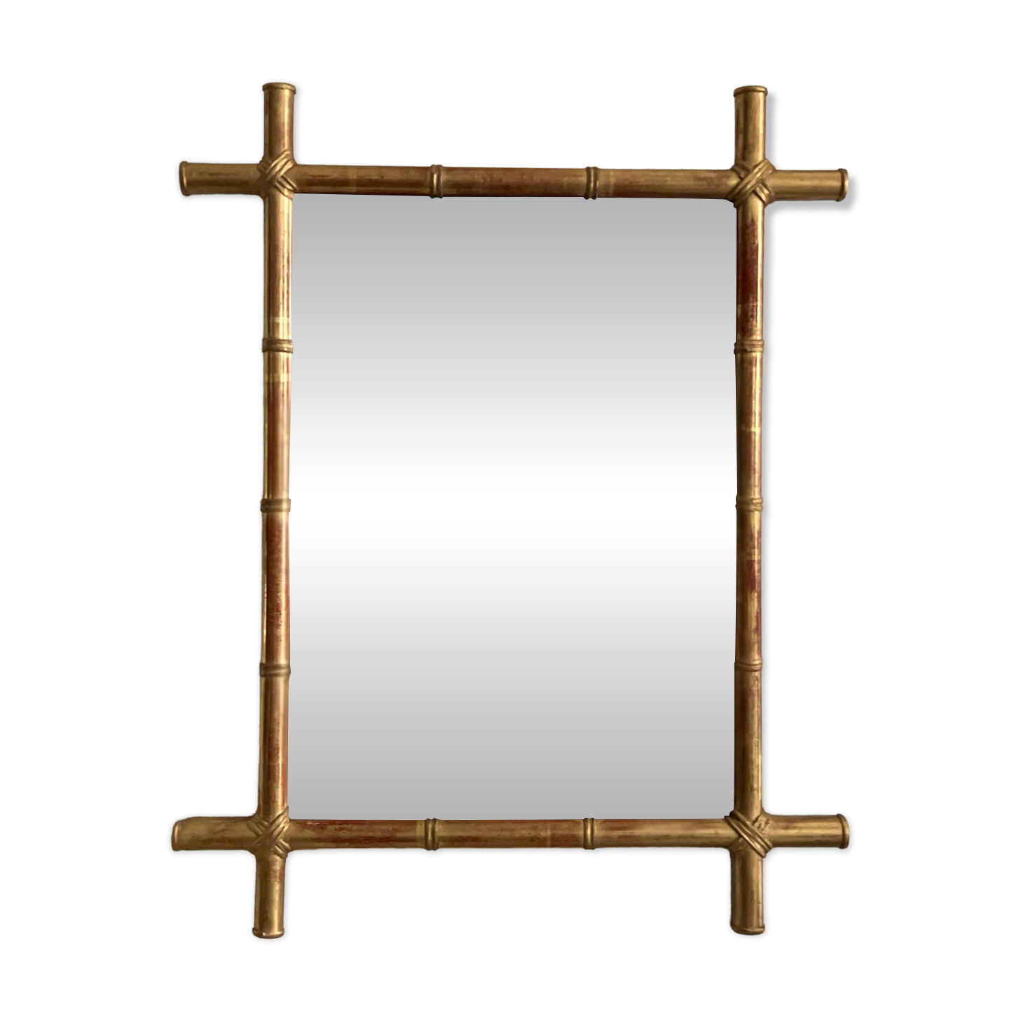 Mirror in gilded stucco, bamboo patina and gold leaf.