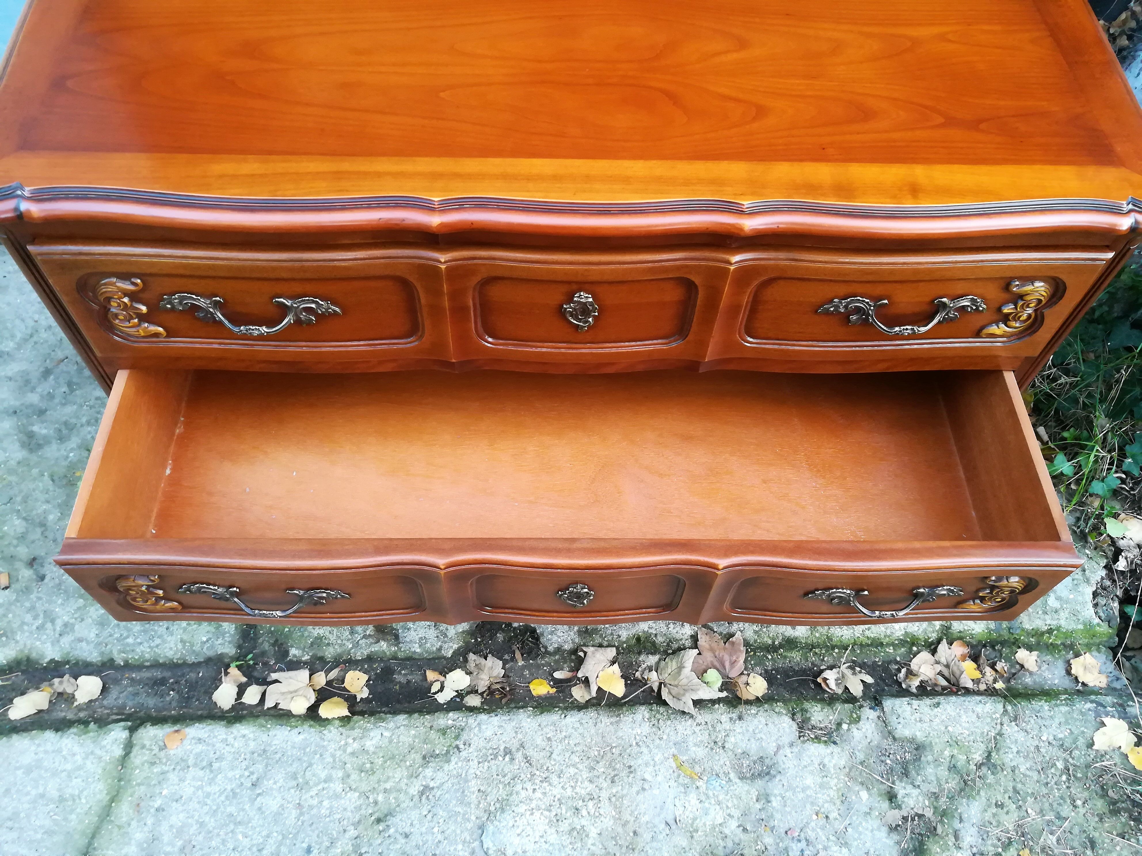 Louis XV style crossbow chest of drawers in cherry wood