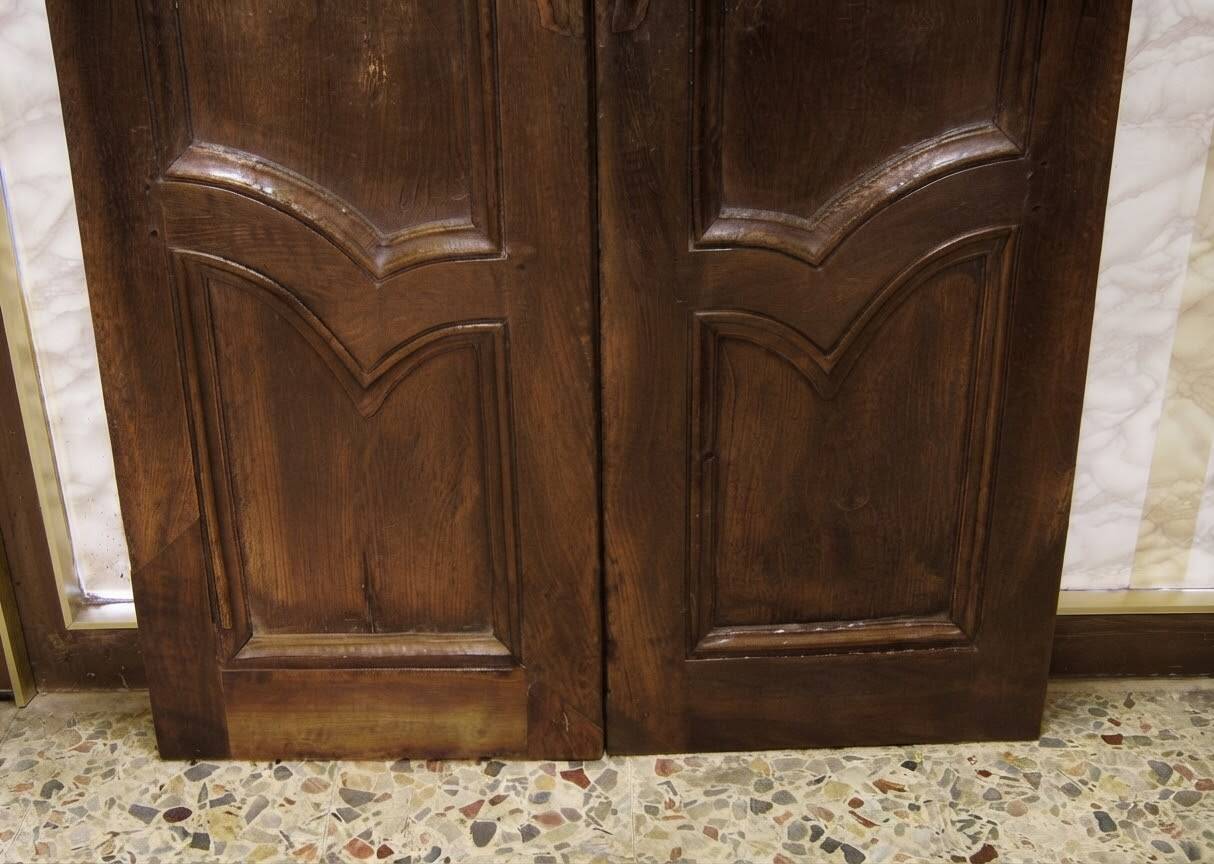 Pair of antique solid walnut doors from the 18th century.