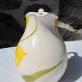 Pitcher with yellow flowers