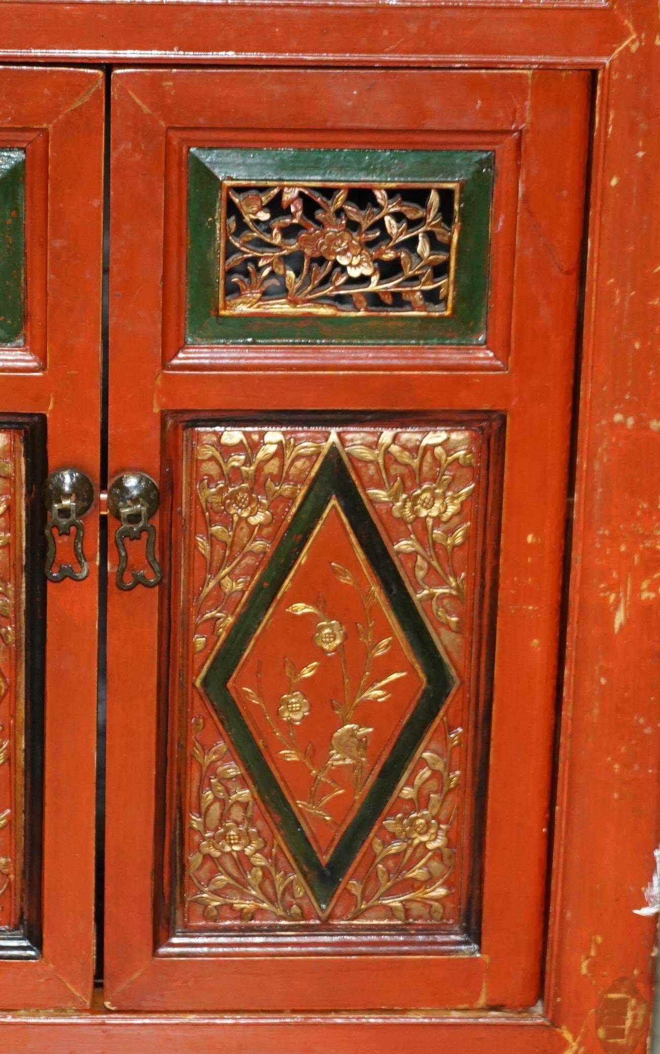 Vintage Chinese lacquered buffet decorated with gold leaf.