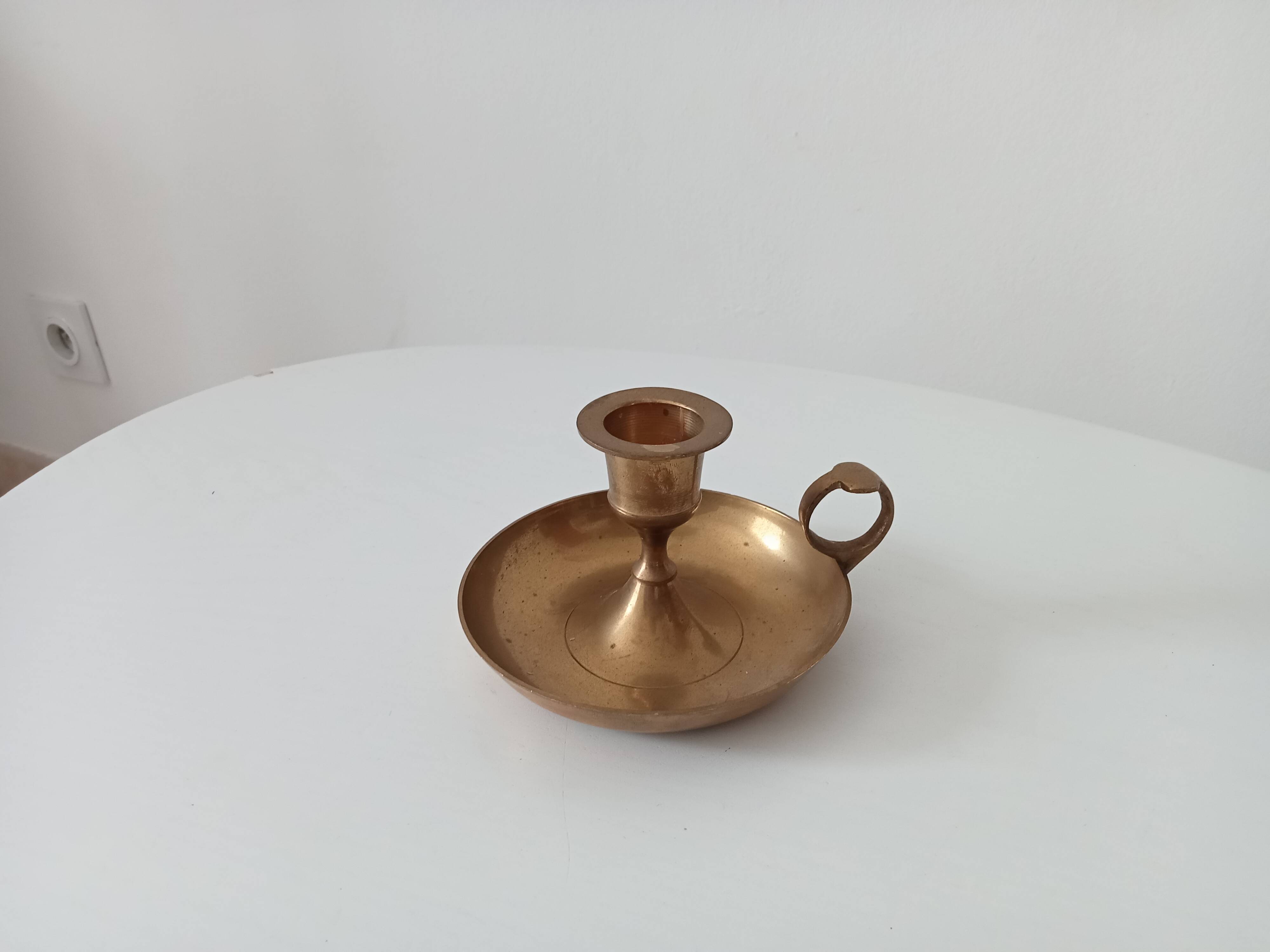 Vintage golden brass hand candle holder