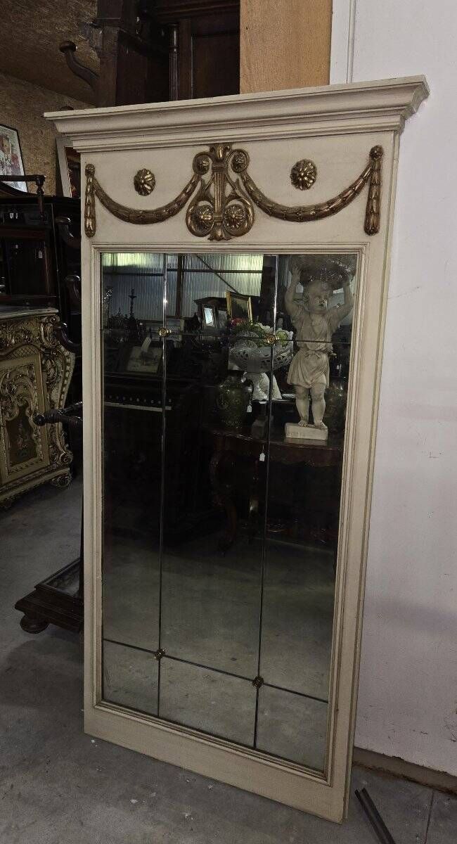 Louis XVI style trumeau mirror with a painted wooden frame.